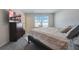 Cozy bedroom with a large window, dresser, and comfortable queen bed at 509 Purple Finch Rd, Summerville, SC 29486