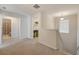Upstairs hallway includes a laundry room, bathroom, and neutral colored walls at 509 Purple Finch Rd, Summerville, SC 29486