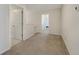 Neutral-colored upstairs hallway leading to other bedrooms at 509 Purple Finch Rd, Summerville, SC 29486