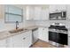 Modern kitchen boasts granite countertops and stainless steel appliances at 509 Purple Finch Rd, Summerville, SC 29486