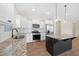 Modern kitchen boasts granite countertops, stainless steel appliances, and a center island at 509 Purple Finch Rd, Summerville, SC 29486