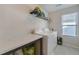 Bright laundry room with washer, dryer, and storage shelves at 509 Purple Finch Rd, Summerville, SC 29486
