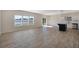 Open floor plan showcases a spacious living area with natural light and modern finishes with wood flooring at 509 Purple Finch Rd, Summerville, SC 29486