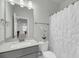 Well-lit bathroom features a shower, toilet, and single sink vanity at 5115 Cranesbill Way, Johns Island, SC 29455