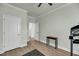 Bright bedroom with a ceiling fan and two doors and a small table at 5115 Cranesbill Way, Johns Island, SC 29455