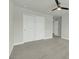 Neutral bedroom featuring a ceiling fan, closet, and view into the hallway at 5115 Cranesbill Way, Johns Island, SC 29455