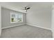 Bedroom filled with natural light from the window and featuring neutral walls and carpet at 5115 Cranesbill Way, Johns Island, SC 29455