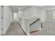 Well-lit hallway featuring neutral walls and carpeted floors leading to other rooms at 5115 Cranesbill Way, Johns Island, SC 29455