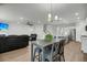 Open floor plan features living room, eat-in kitchen with stainless steel appliances, and dining table at 5115 Cranesbill Way, Johns Island, SC 29455