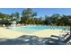 Community swimming pool with zero entry and lounge chairs for relaxing by the water at 5115 Cranesbill Way, Johns Island, SC 29455