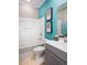 Bright bathroom with a shower-tub combo, gray vanity, and coastal-themed decor at 523 Verdi Dr, Summerville, SC 29486