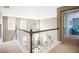 Hallway overlooking the Gathering room with white railing and a view of the Gathering room's modern furnishings at 523 Verdi Dr, Summerville, SC 29486
