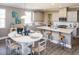 Eat-in kitchen features stainless appliances, light grey cabinetry and a central island with bar stool seating at 523 Verdi Dr, Summerville, SC 29486