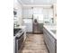 Modern kitchen showcases stainless steel appliances, granite countertops, and light grey cabinetry at 523 Verdi Dr, Summerville, SC 29486
