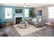 Cozy living room with a fireplace, ample seating, and a ceiling fan at 523 Verdi Dr, Summerville, SC 29486