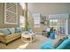 Bright living room with large windows features modern furniture and decor at 523 Verdi Dr, Summerville, SC 29486