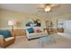 Cozy living room with soft lighting features comfortable seating and bright, beachy decor at 523 Verdi Dr, Summerville, SC 29486