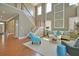 Spacious living room with hardwood floors and stairs features comfortable furniture and high ceilings at 523 Verdi Dr, Summerville, SC 29486