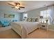 A relaxing main bedroom with pale blue walls and a white sleigh bed frame with soft, neutral-toned furnishings at 523 Verdi Dr, Summerville, SC 29486