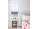 Bright bedroom features a beautiful water view outside the window with white curtains at 538 Spanish Wells Rd, Summerville, SC 29486