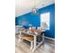 The dining room has a view of the back yard and a decorative hanging light fixture at 538 Spanish Wells Rd, Summerville, SC 29486