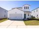 Charming two-story home featuring white siding, a two-car garage, and a well-maintained front yard at 538 Spanish Wells Rd, Summerville, SC 29486