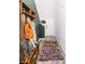 Hallway features a colorful rug, a built-in bench, and a coat rack for storing belongings at 538 Spanish Wells Rd, Summerville, SC 29486