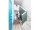 Inviting foyer with a colorful rug, staircase, and stylish coat rack, leading into the home's interior at 538 Spanish Wells Rd, Summerville, SC 29486