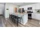 The Kitchen features a large center island with seating, stainless appliances, and white cabinets at 538 Spanish Wells Rd, Summerville, SC 29486