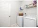 Laundry room with new washer and dryer, storage shelf, and a door at 538 Spanish Wells Rd, Summerville, SC 29486