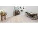Bright living room featuring a cozy chair, stylish decor, and abundant natural light perfect for relaxation at 538 Spanish Wells Rd, Summerville, SC 29486