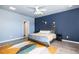 The main bedroom has a large bed, decor, ceiling fan, and large windows at 538 Spanish Wells Rd, Summerville, SC 29486