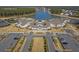 Aerial view of the community clubhouse, parking, and surrounding landscapes at 572 Tidewater Chase Ln, Summerville, SC 29486