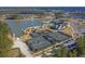 Aerial view showcasing the community's amenities: tennis courts, pool, lake access at 572 Tidewater Chase Ln, Summerville, SC 29486