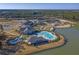 Aerial view of community amenities including pools, clubhouses, tennis courts, and waterfront access at 572 Tidewater Chase Ln, Summerville, SC 29486