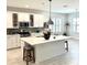 Bright kitchen with white cabinets, stainless appliances, and a spacious island at 572 Tidewater Chase Ln, Summerville, SC 29486