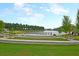 Lakeside area with landscaped terraces, walking paths, and scenic views for relaxation at 572 Tidewater Chase Ln, Summerville, SC 29486