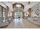 Lobby with high ceilings, modern furnishings, and elegant chandelier at 572 Tidewater Chase Ln, Summerville, SC 29486