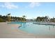 Stunning community pool surrounded by palm trees and ample lounging space, perfect for enjoying sunny days at 572 Tidewater Chase Ln, Summerville, SC 29486