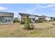 Home backyard with covered patio and outdoor grill, set against a backdrop of tall trees at 614 Battery Edge Dr, Summerville, SC 29486