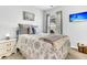 This bedroom boasts soft, neutral colors with artwork and a TV, creating a calming and inviting space at 614 Battery Edge Dr, Summerville, SC 29486
