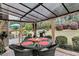 Covered patio dining area with comfortable wicker chairs and outdoor view at 614 Battery Edge Dr, Summerville, SC 29486