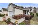 Charming home exterior boasts manicured landscaping, walkway, and attached garage at 614 Battery Edge Dr, Summerville, SC 29486