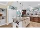 Spacious kitchen island with a granite countertop and views of the breakfast area and kitchen sink at 614 Battery Edge Dr, Summerville, SC 29486