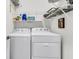 Laundry room featuring full-sized white washing machine and dryer with wire shelving above at 614 Battery Edge Dr, Summerville, SC 29486