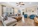 Comfortable living room featuring a plush sectional sofa, stylish decor, and lots of natural light at 614 Battery Edge Dr, Summerville, SC 29486