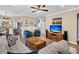 Cozy living area featuring a large sectional sofa, hardwood floors, and a media center at 614 Battery Edge Dr, Summerville, SC 29486