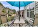 Outdoor patio setting with comfortable seating, dining area, barbeque grill, and well-maintained yard at 614 Battery Edge Dr, Summerville, SC 29486