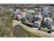 Beautiful aerial view of homes in a suburban neighborhood surrounding a small pond on a sunny day at 740 Stucco Ln, Mount Pleasant, SC 29464