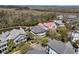 A bird's-eye view captures an idyllic neighborhood setting with lush landscapes and well-maintained properties at 740 Stucco Ln, Mount Pleasant, SC 29464